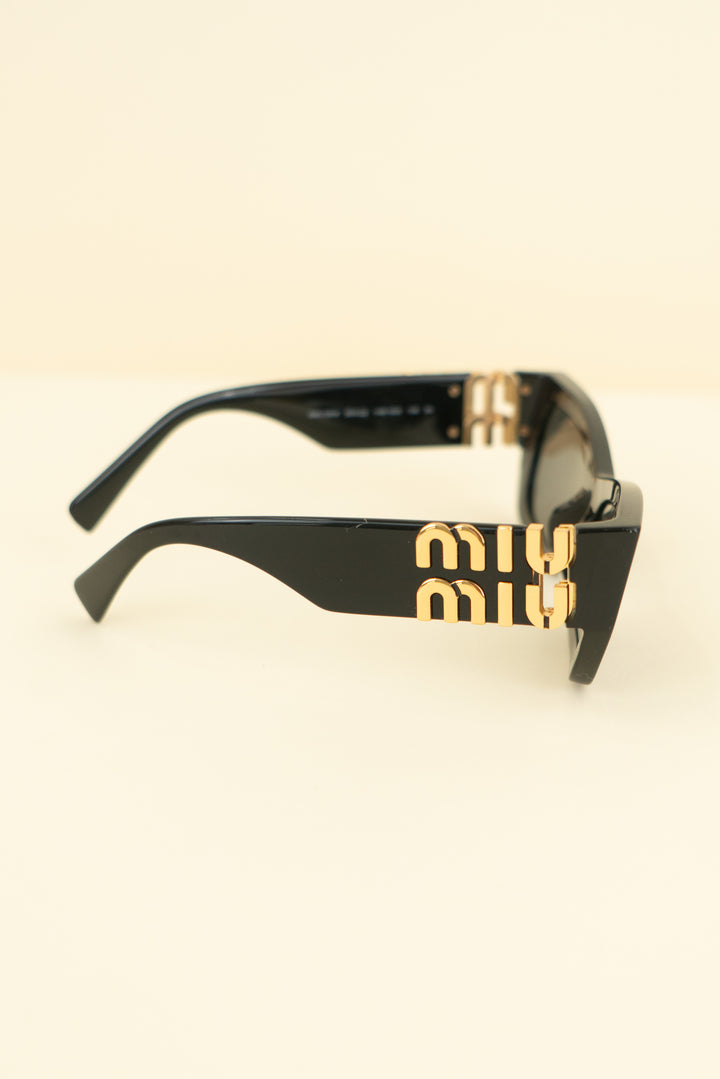 miu miu black and gold sunglasses (os; retail $518)