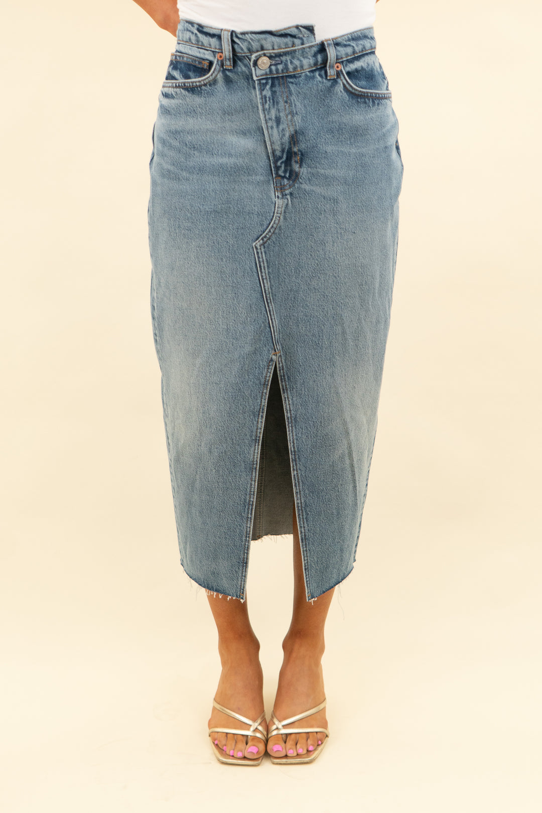 reformation medium wash midi denim skirt with front slit (27; retail $168)