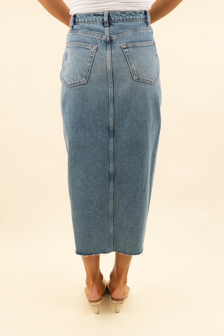 reformation medium wash midi denim skirt with front slit (27; retail $168)