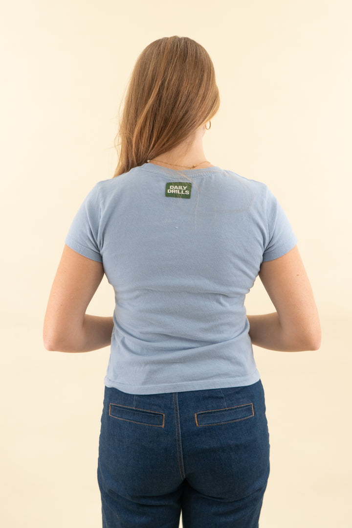 daily drills blue baby tee (m/l retail $55)
