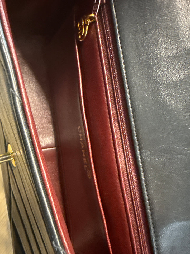 Chanel Black Lambskin Bias Quilted Shoulder Bag (vintage; typical resale $7,000)