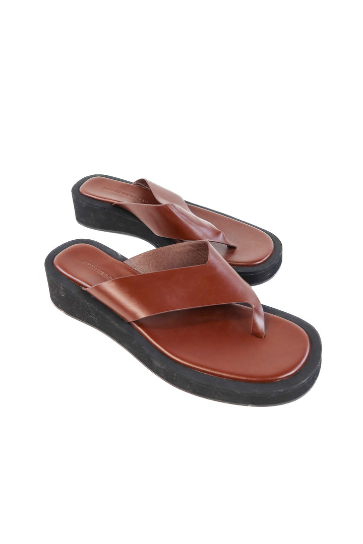 Princess Polly brown platform flip flops (8; retails for $59)