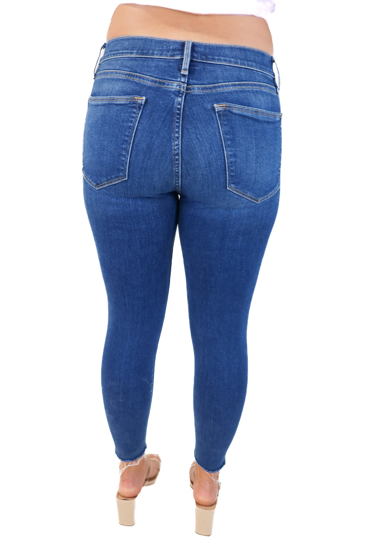 Frame medium wash distressed skinny jeans (28; retail $220)