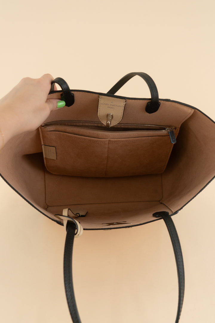 AUCTION louis vuitton black and cream lockme cabas leather tote bag (est. retail $3,250)