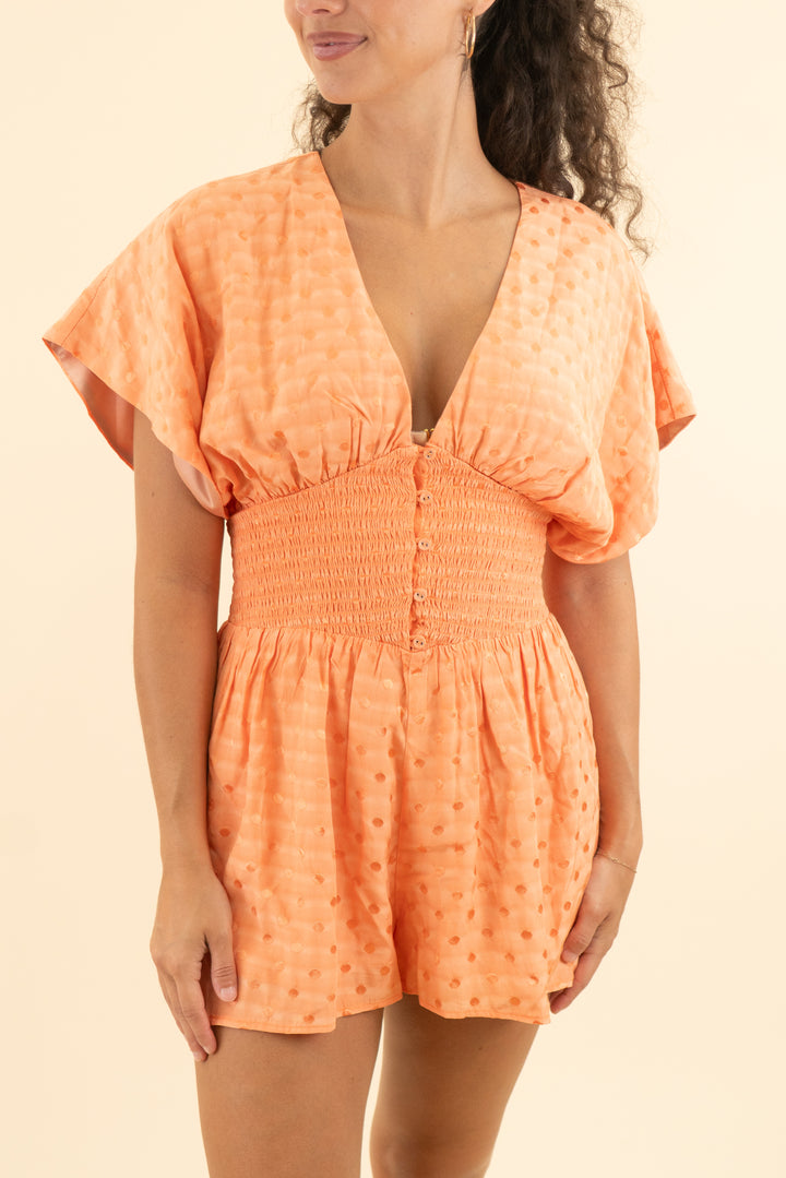 tularosa orange polka dot short sleeve romper (s; retail $168)