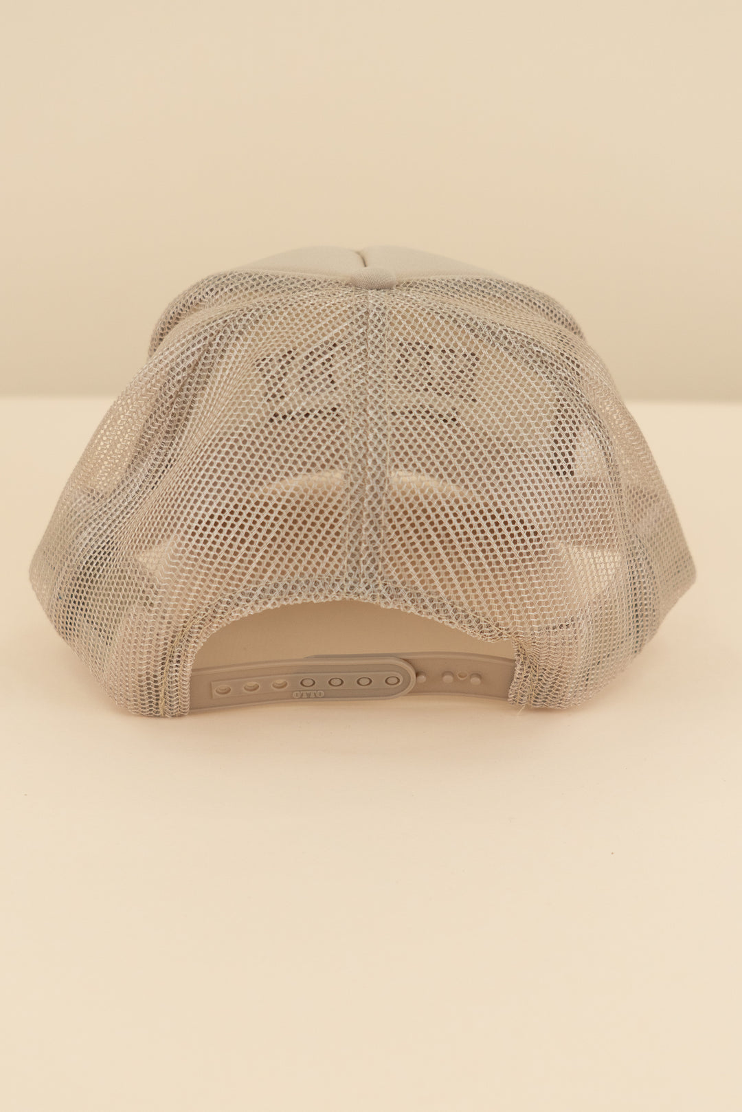 tan "howdy let's get nuud" trucker hat (os; retail $40)