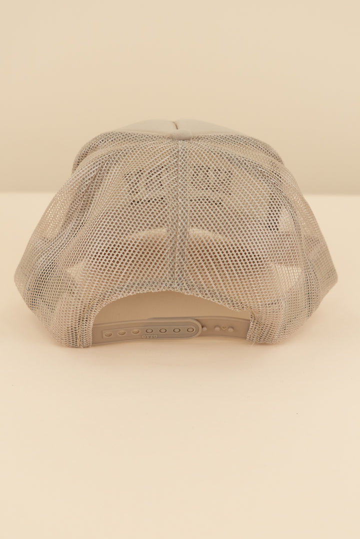 tan "howdy let's get nuud" trucker hat (os; retail $40)
