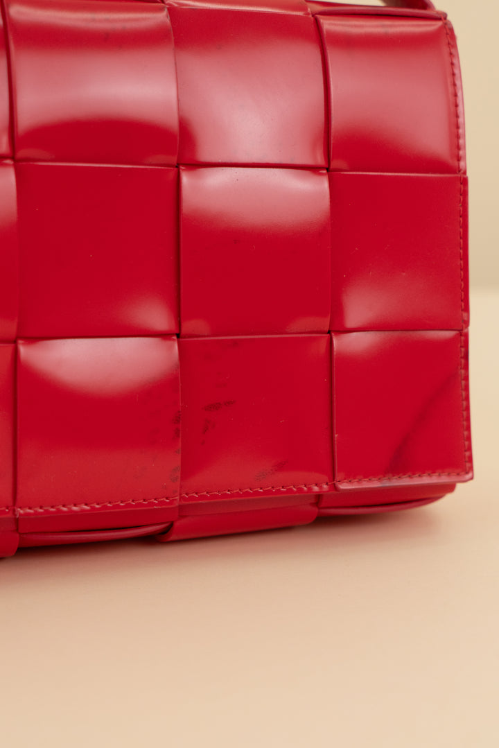 Bottega Veneta red intreccio cassette bag (retail $3,100)