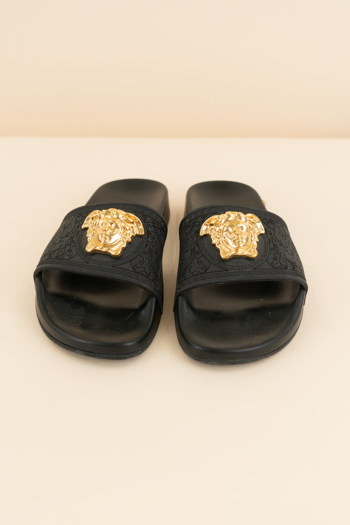 versace black slides with gold emblem (37/ US 6.5-7; retail $495)
