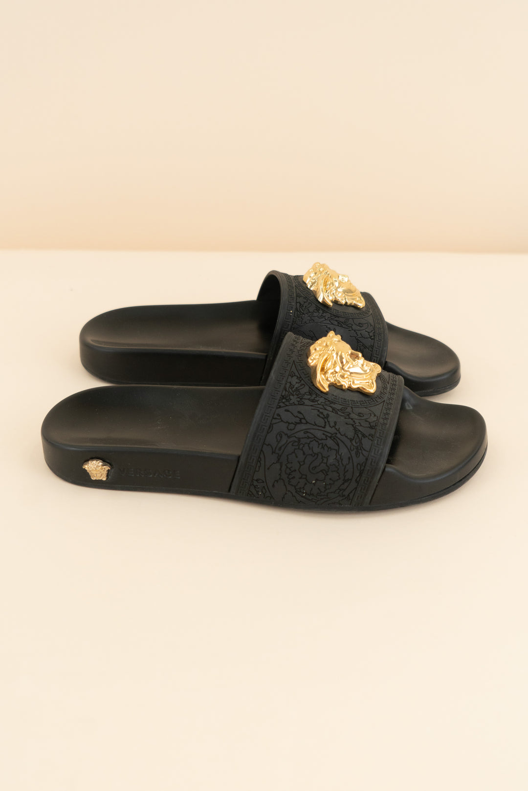 versace black slides with gold emblem (37/ US 6.5-7; retail $495)