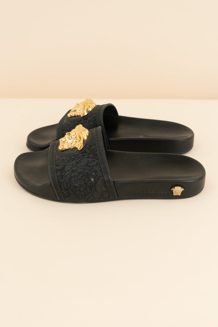 versace black slides with gold emblem (37/ US 6.5-7; retail $495)