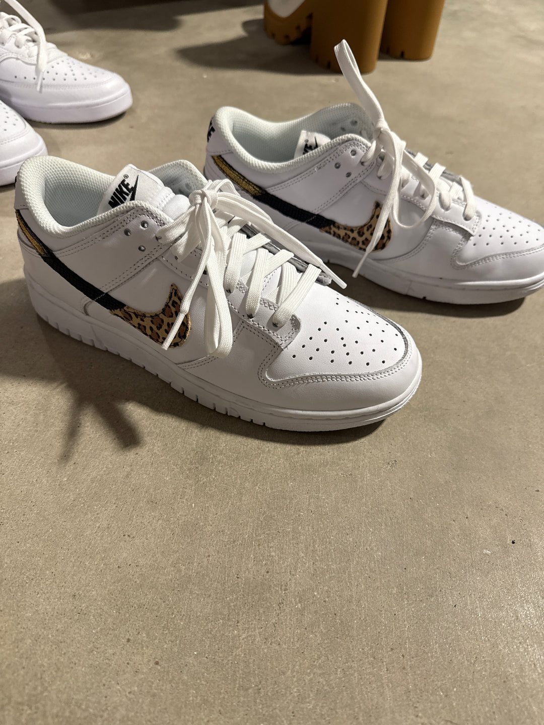 SOLD Nike white low top cheetah/gold sneakers NWOT (8.5; retail $149)