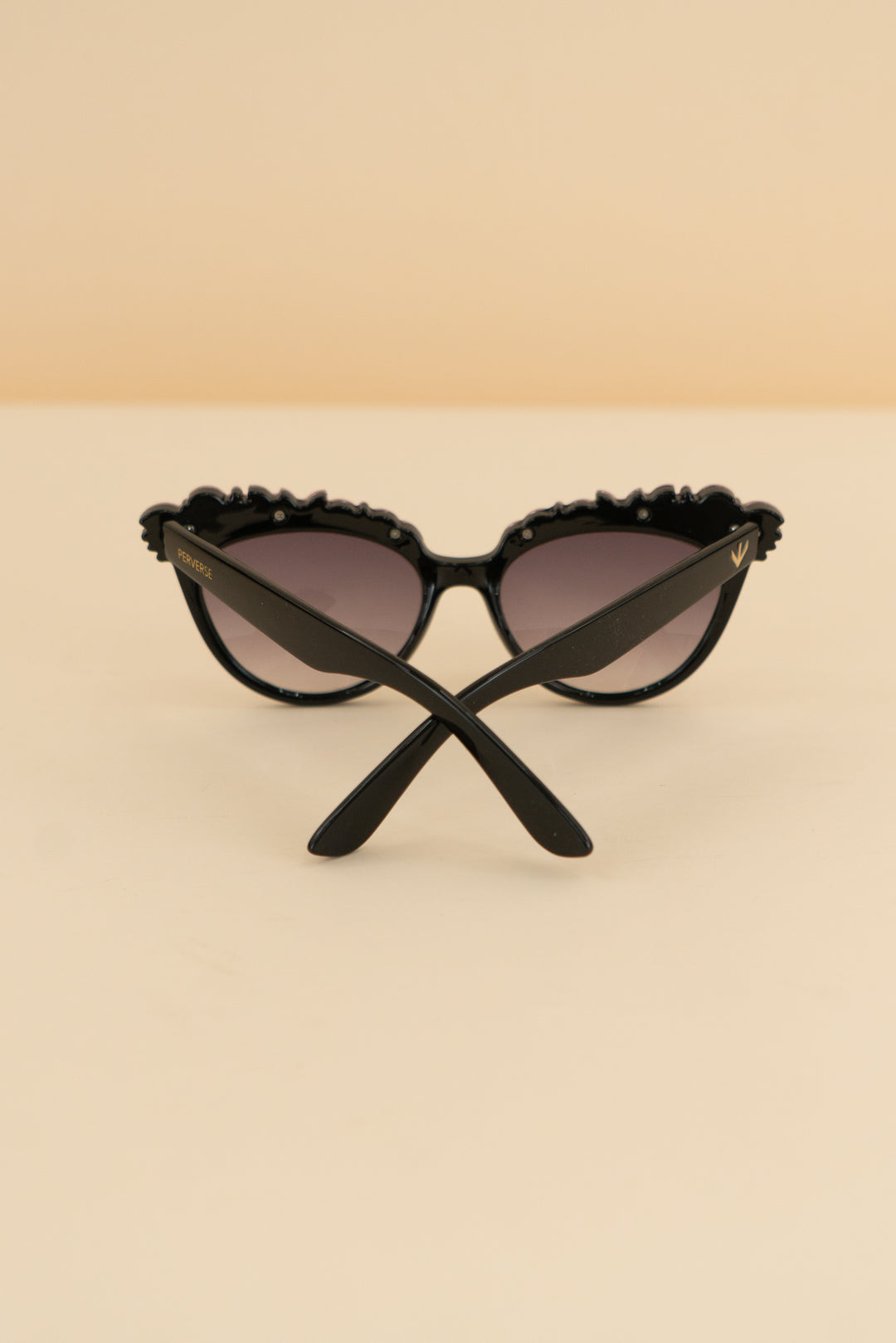 persevere black sunglasses w/ pink gemstones