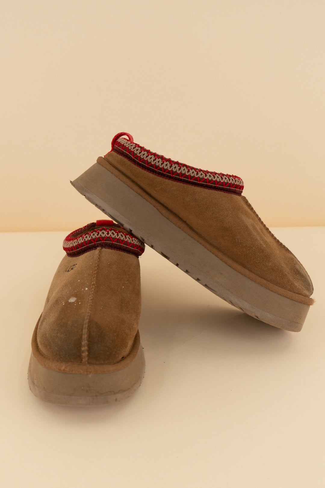 ugg chestnut tasman slippers with red stitching (8; retail $145)
