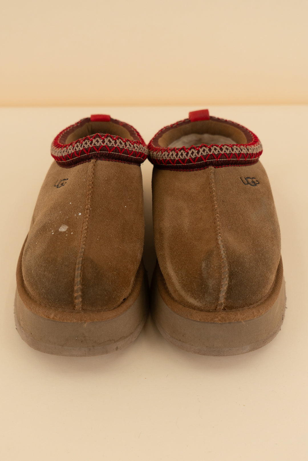 ugg chestnut tasman slippers with red stitching (8; retail $145)