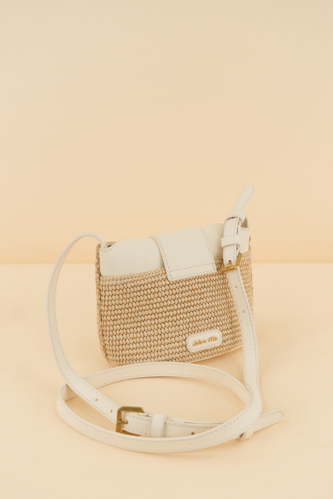 dolce vita cream/tan weave crossbody bag