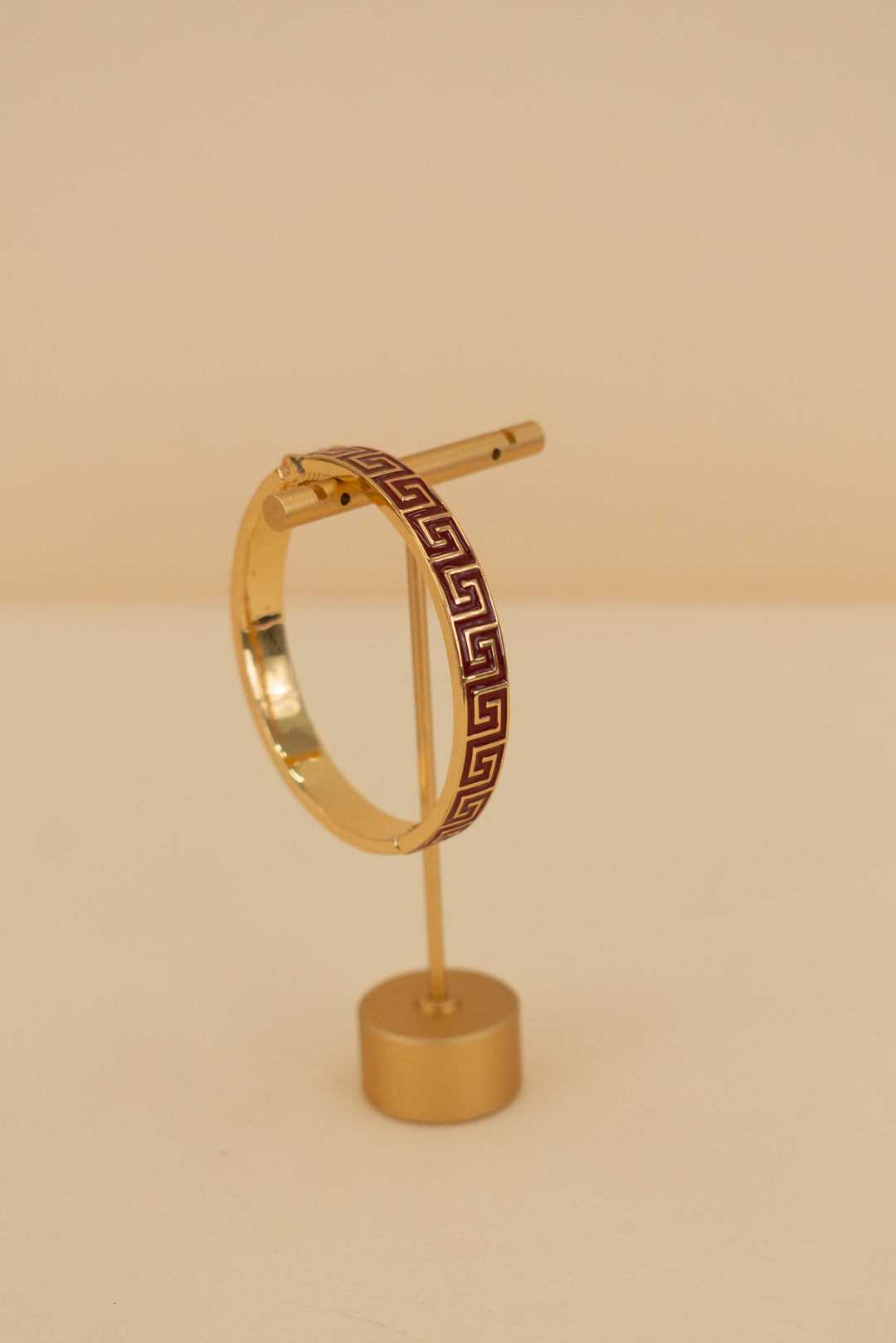 gold and ruby red bangle with greek design (os)