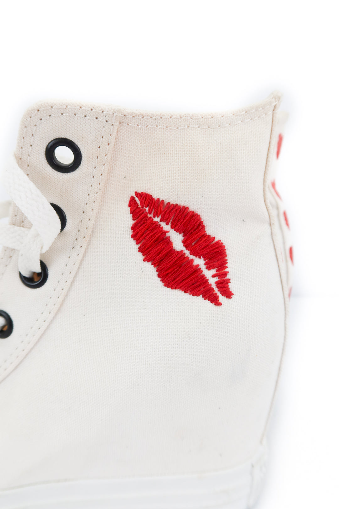 converse white sneakers with lip embroidery (7; retail $150)
