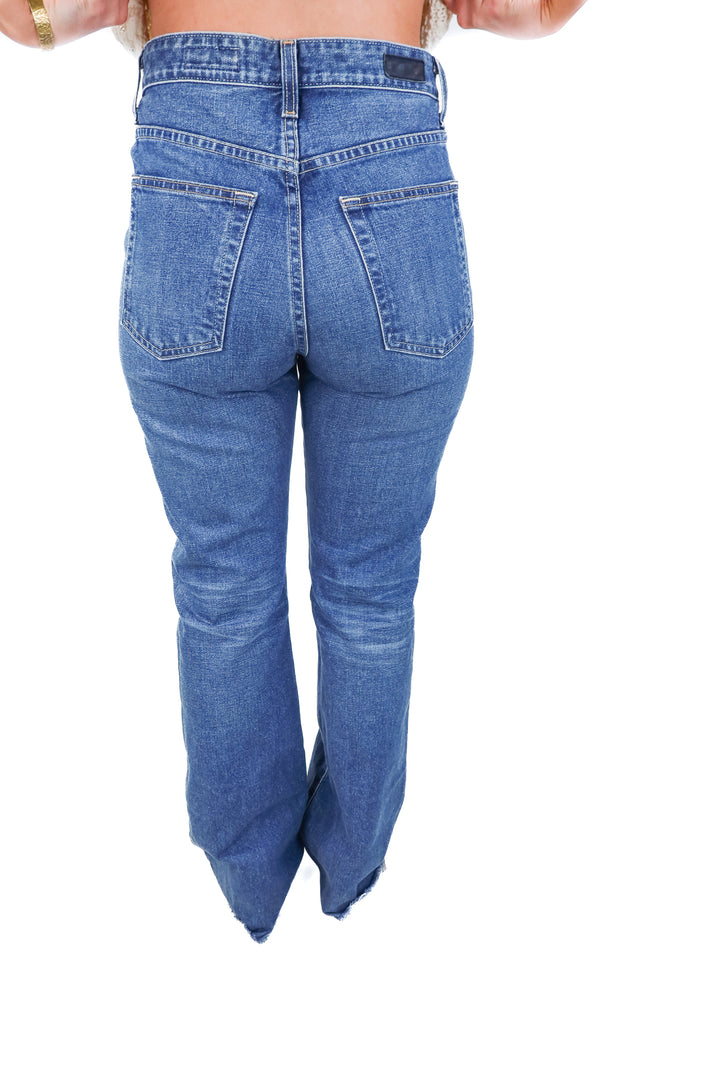 AG medium wash raw hem jeans (29R)