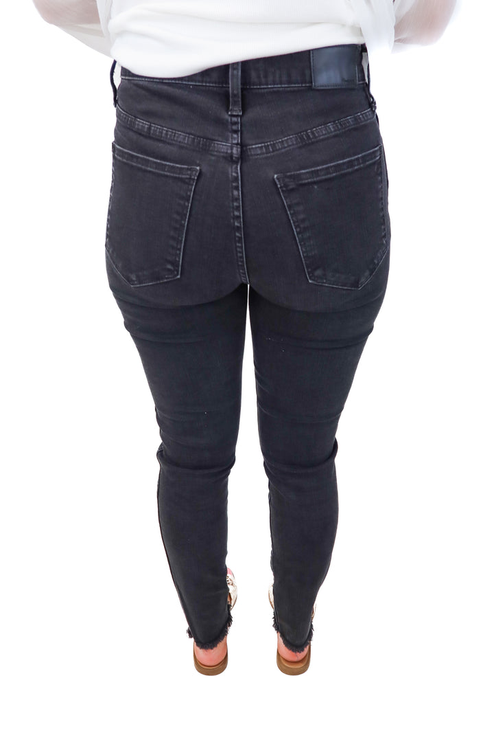 madewell black high-rise skinny jeans (27; retail $128)