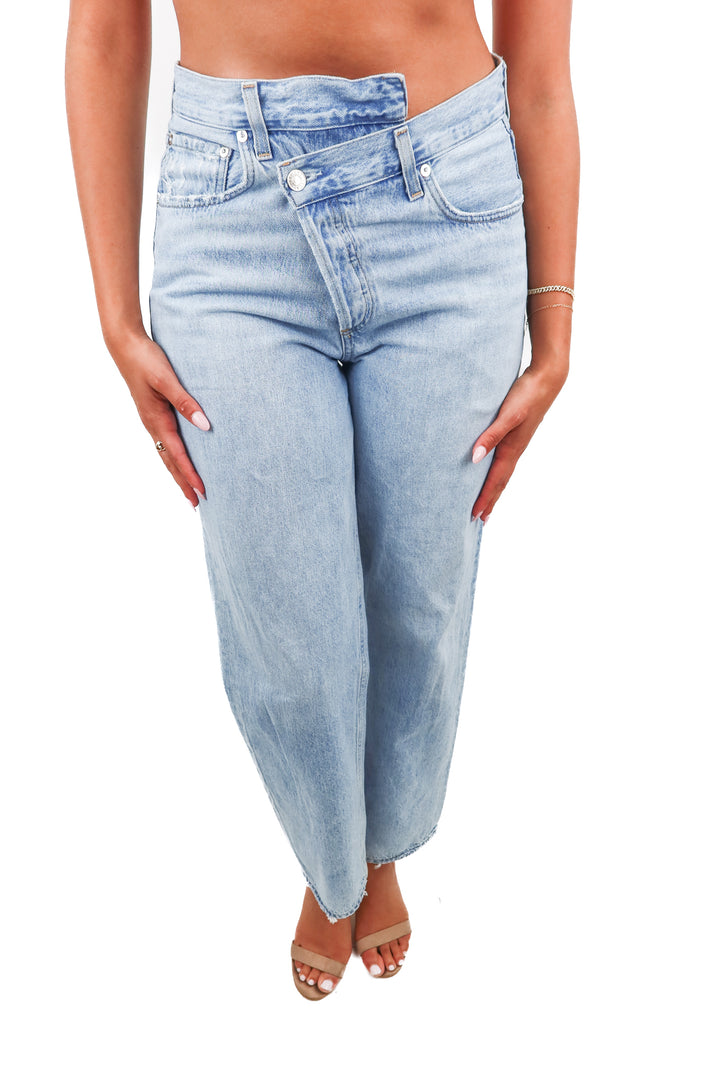 agolde light wash asymmetrical jeans (26; retail $278)