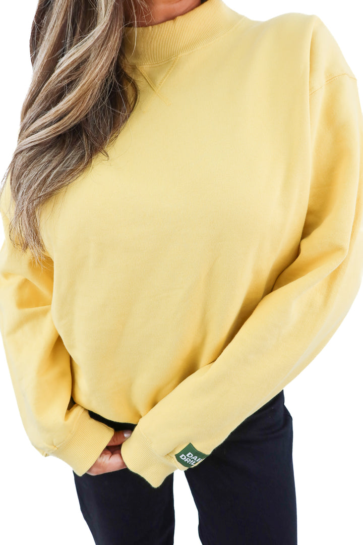 daily drills mustard crewneck (m; retail $125)