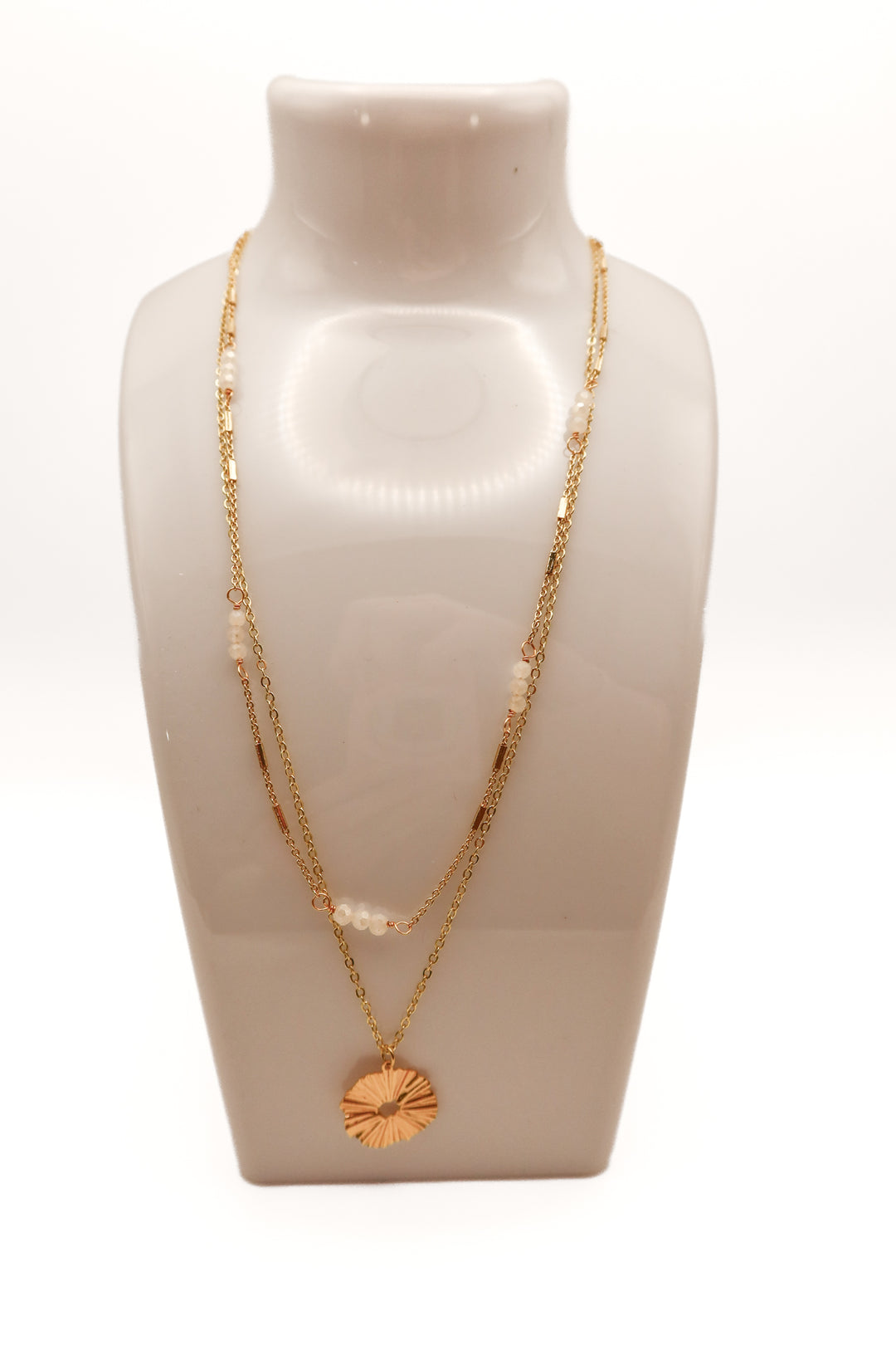 Gold layered necklace with circle pendant