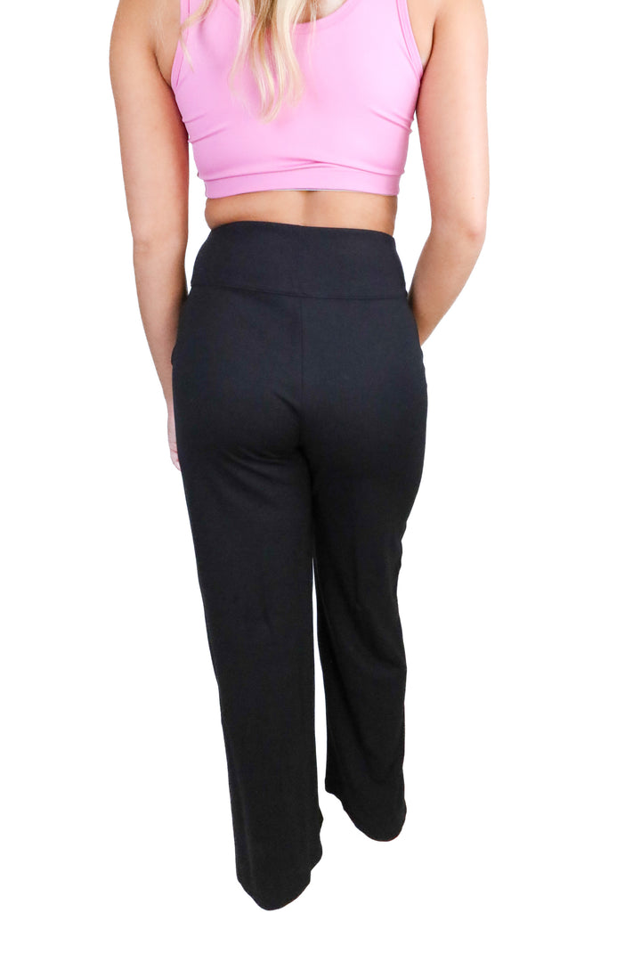 Travis Mathew black flare yoga pants w/ slit NWT (XS; retail $129.95)