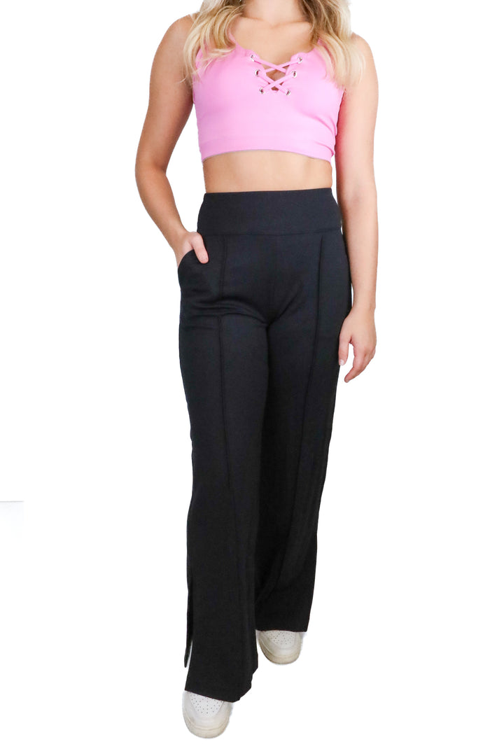 Travis Mathew black flare yoga pants w/ slit NWT (XS; retail $129.95)
