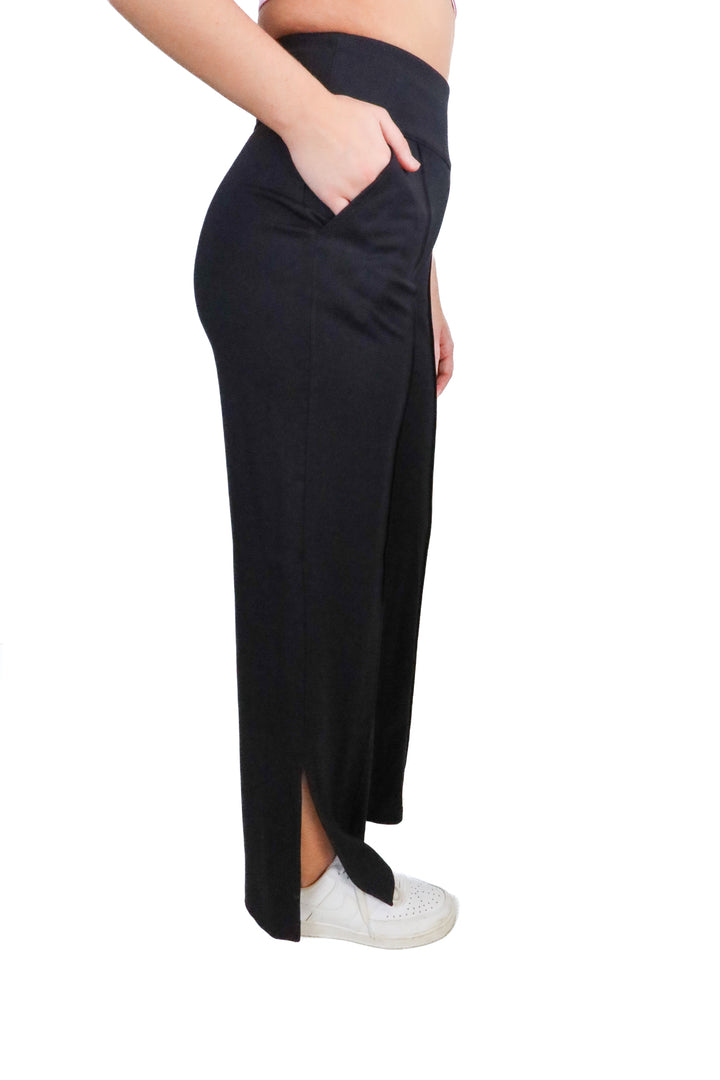 Travis Mathew black flare yoga pants w/ slit NWT (XS; retail $129.95)