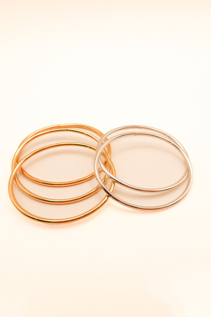 SOLD: Set of 5 Jenny bird gold/silver bangles ($218 for the bunch!)