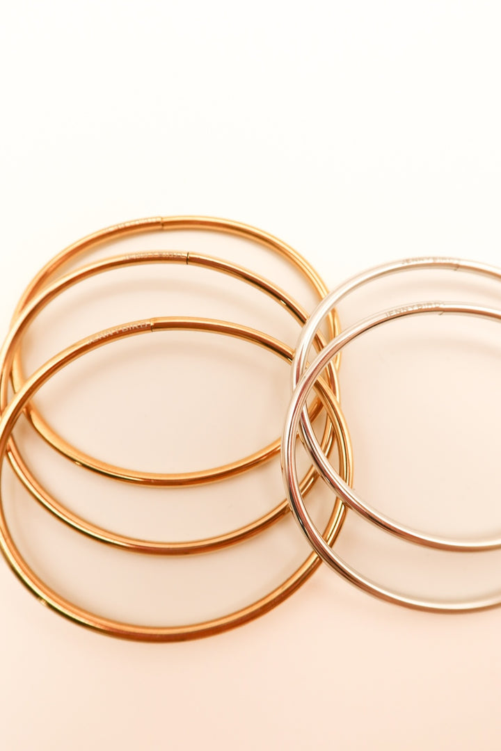 SOLD: Set of 5 Jenny bird gold/silver bangles ($218 for the bunch!)