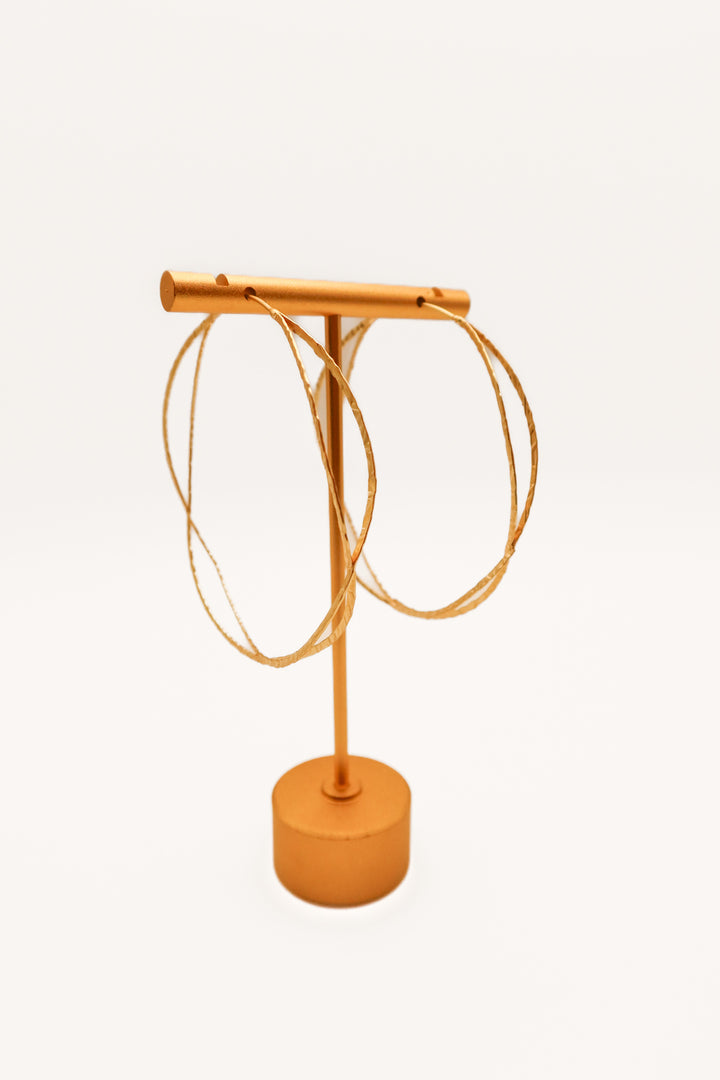 Gold criss cross hoop earrings