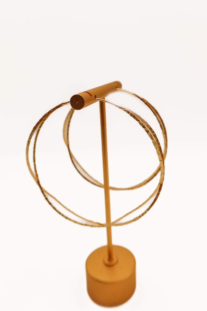 Gold criss cross hoop earrings