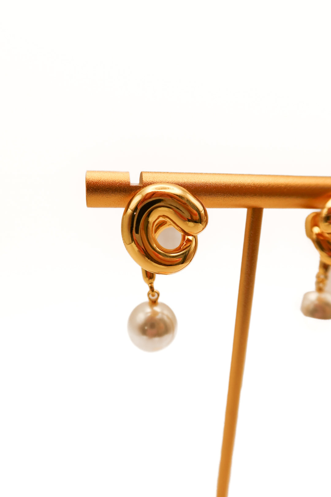 SOLD: Jenny bird gold swirl pearl earrings (retail $138)