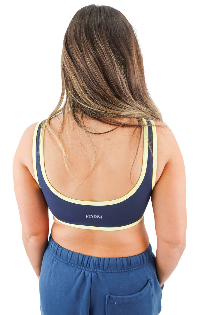 form navy/yellow sports bra (L; retail $68)