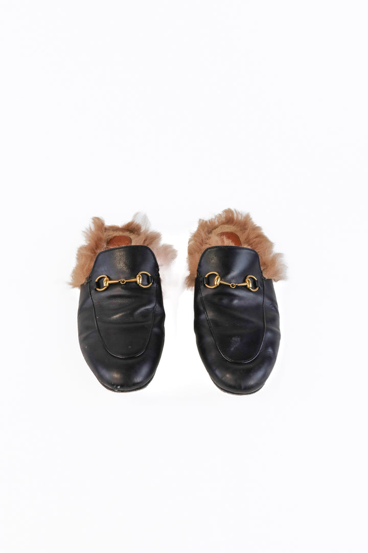 Gucci black leather loafers (39/ US9; retail $1,090)