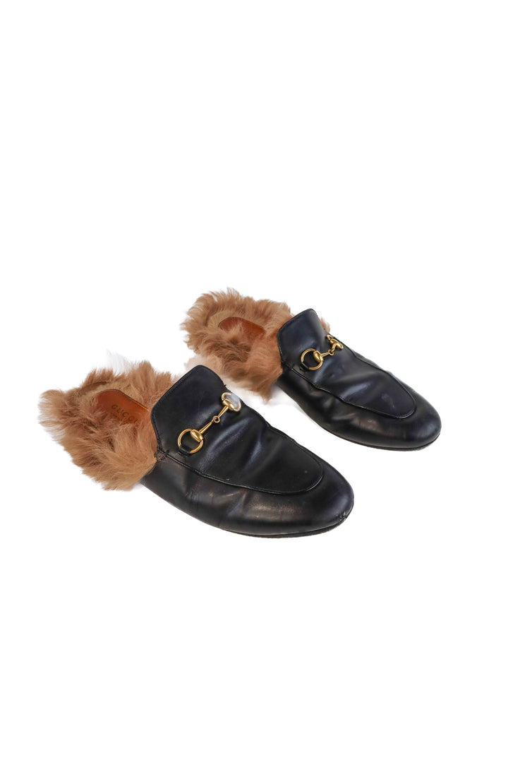 Gucci black leather loafers (39/ US9; retail $1,090)
