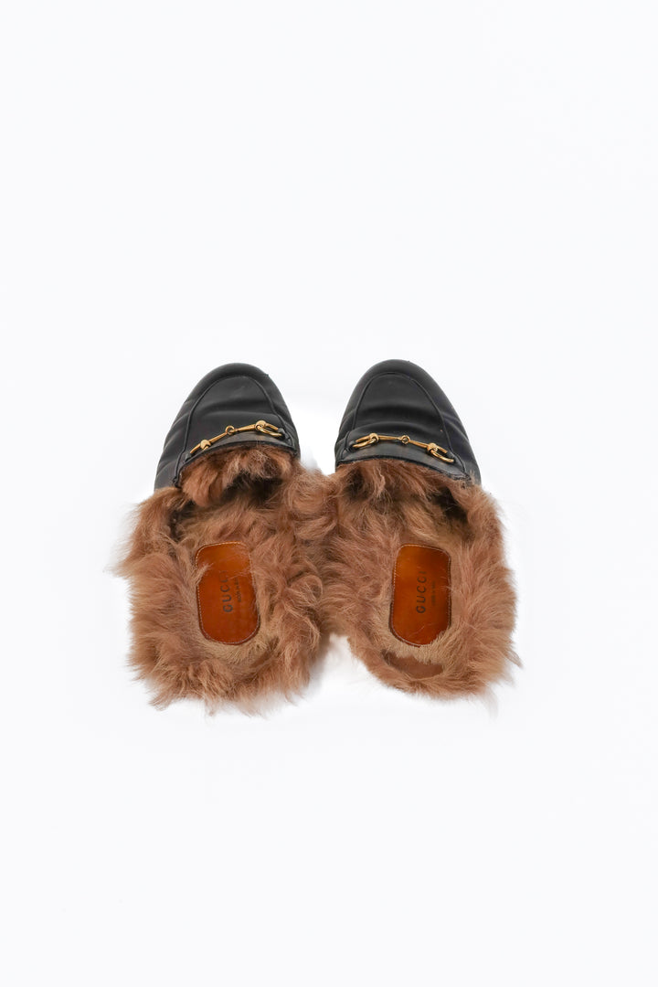 Gucci black leather loafers (39/ US9; retail $1,090)