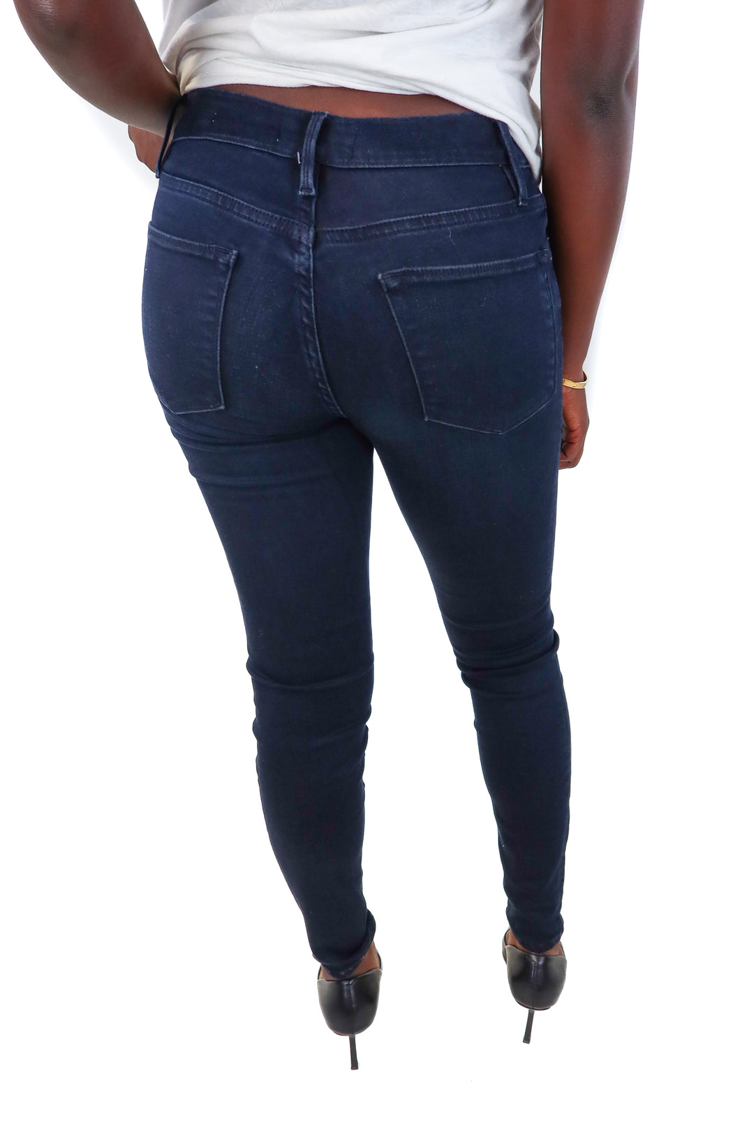 Frame dark wash skinny jeans (25; retail $228)