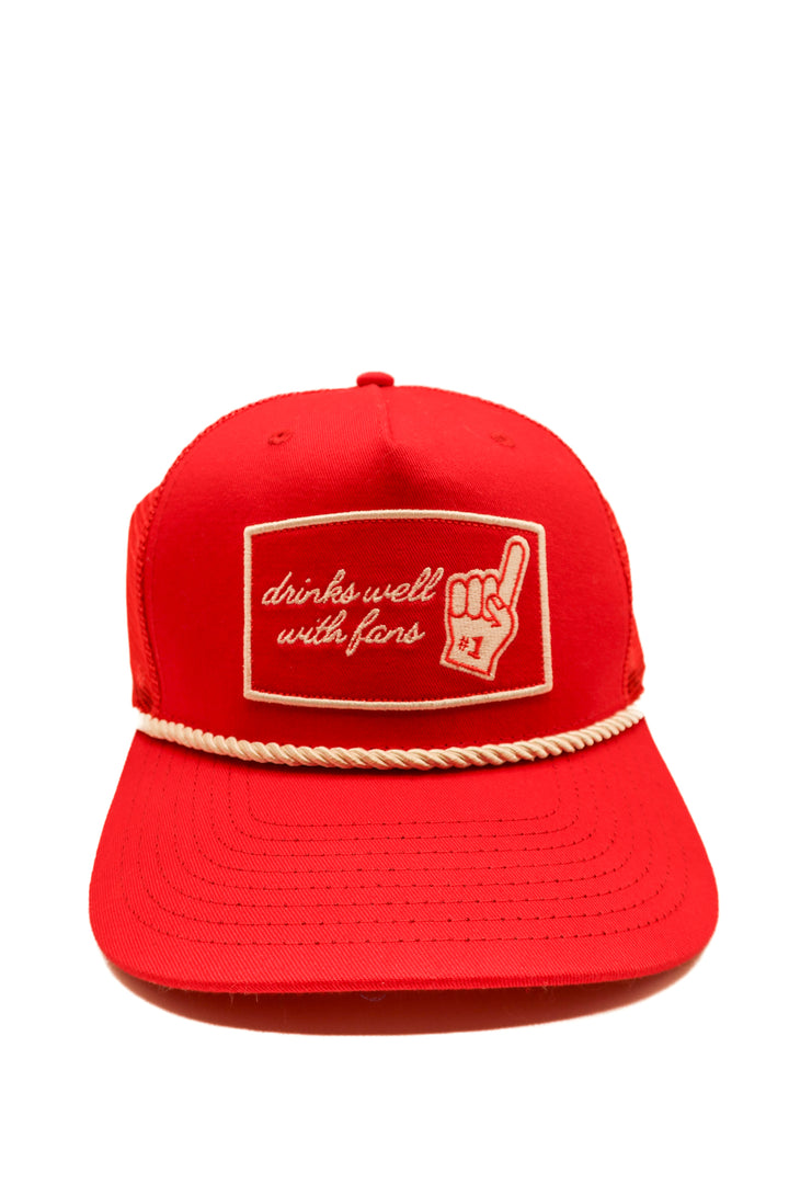 “Drinks well with fans” red hat