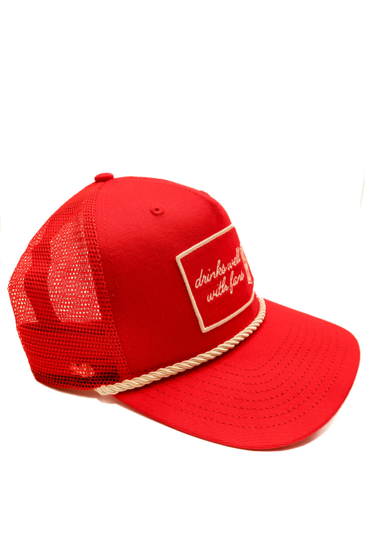 “Drinks well with fans” red hat