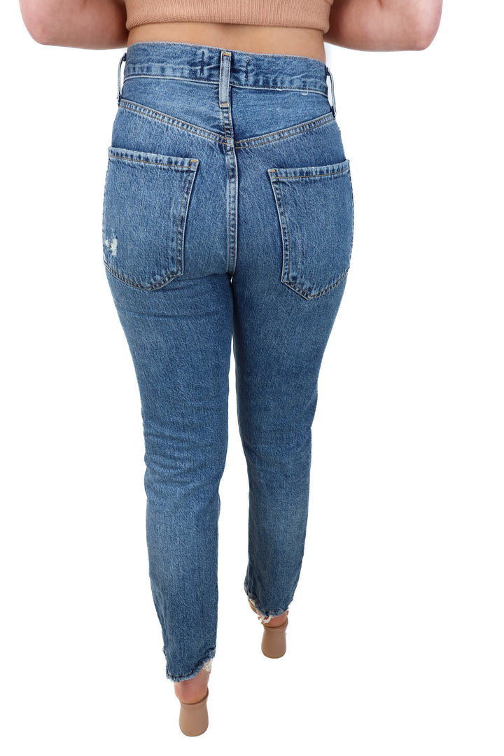 agolde medium wash raw hem jeans (25; retail $198)