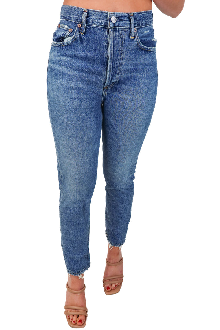 agolde medium wash raw hem jeans (25; retail $198)