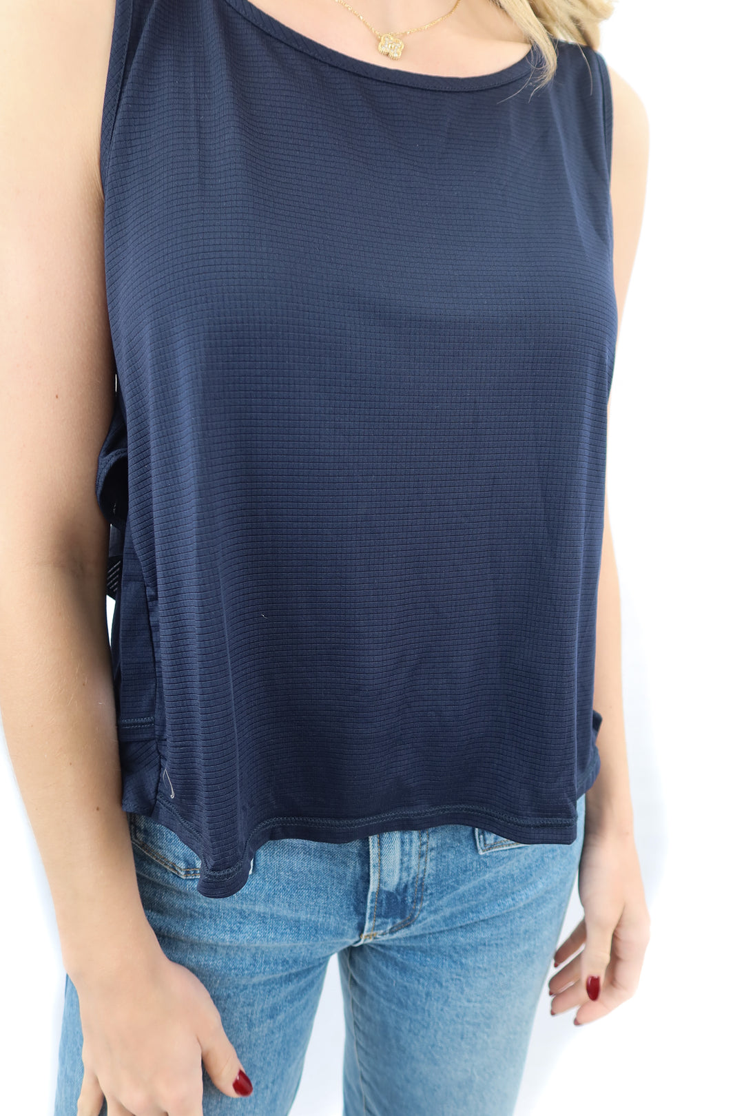 The Bubble The GG navy blue ruffled sleeveless workout top (M; retail $99.99)