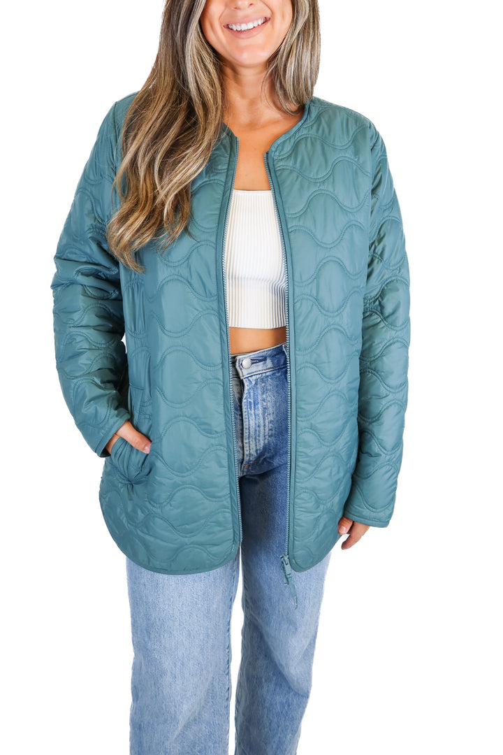 Travis Mathew teal jacket (L)