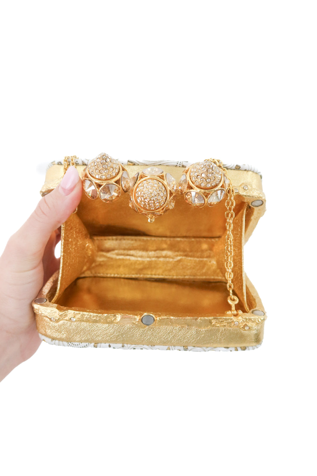 clara kasavina gold and white clutch