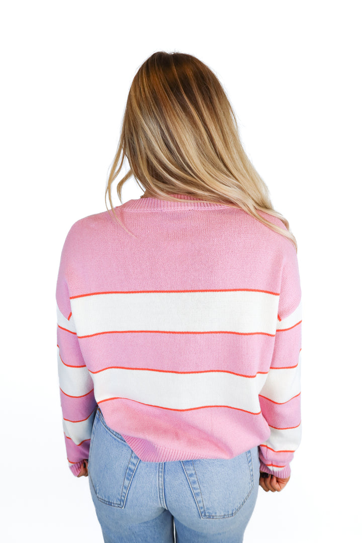 Kittenish pink/orange striped sweater (S)