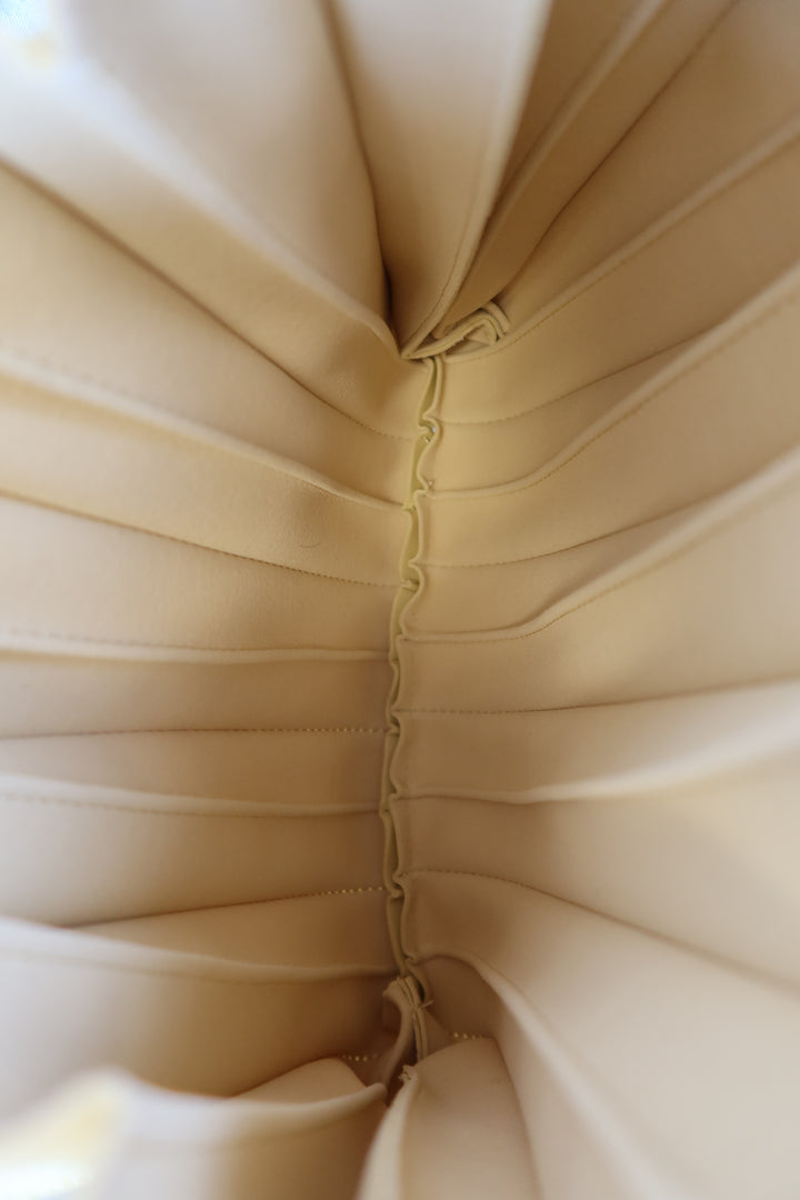 Melie bianco yellow pleated bag NWT; retails for $120