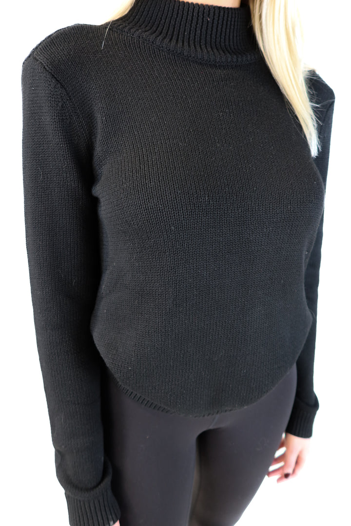 NBD black turtleneck open back sweater (s; retails for $168)